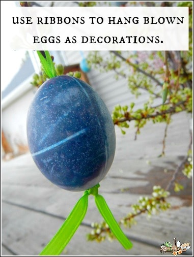 blown Easter egg hanging with ribbon