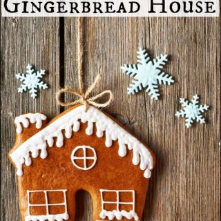Gingerbread House with Snowflakes on wooden board