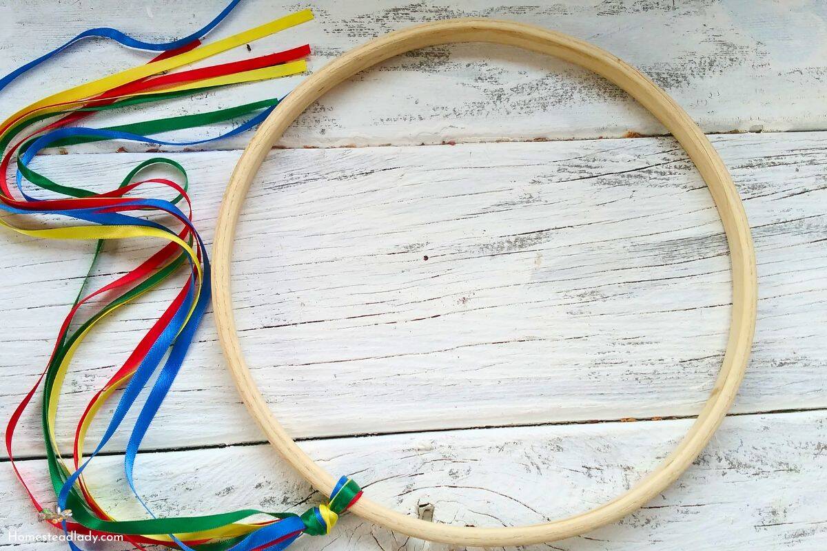 game of graces hoop with ribbons on a white table