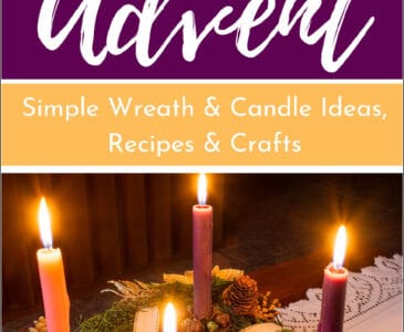 advent wreath with lit candles on a table
