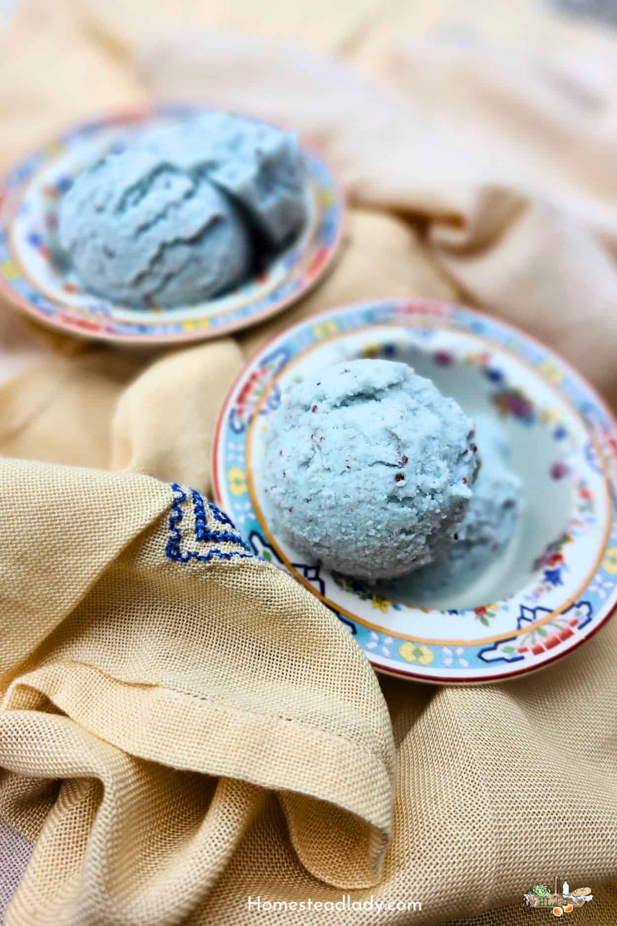 blue mint ice cream in two colored dishes