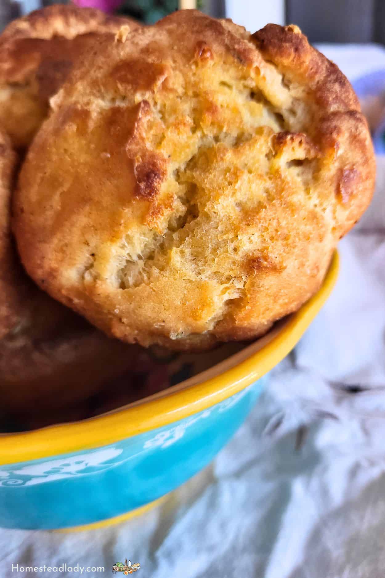 savory sourdough Yorkshire pudding popovers in a blue and yellow bowl